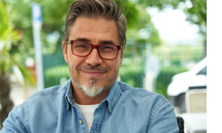 Middle aged man smiling with glasses. Seb C Wysa user story