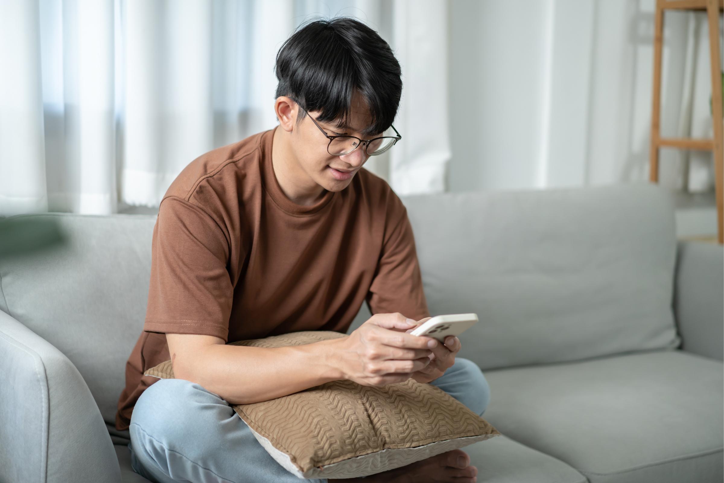 Young adult looking at phone