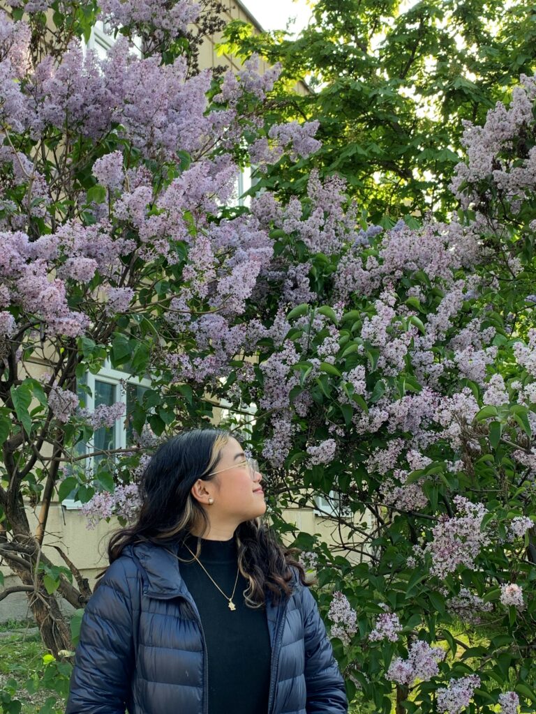 A real Wysa app user in nature sat under a tree.